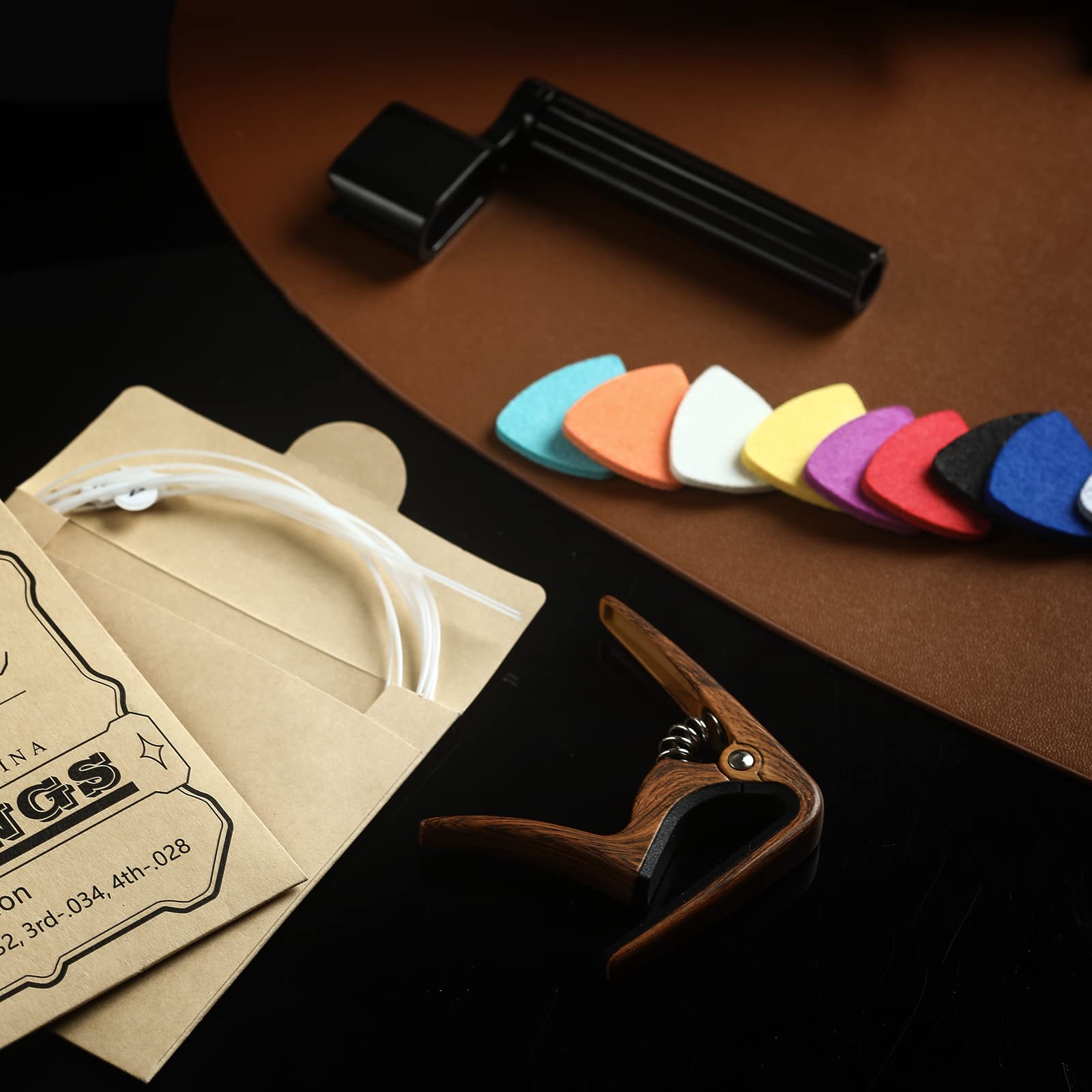 Donux Nylon Ukulele Strings Kit,Include 5 Sets Strings,10 Pieces Ukelele Felt Picks,Capo And String Winder For Soprano Concert A