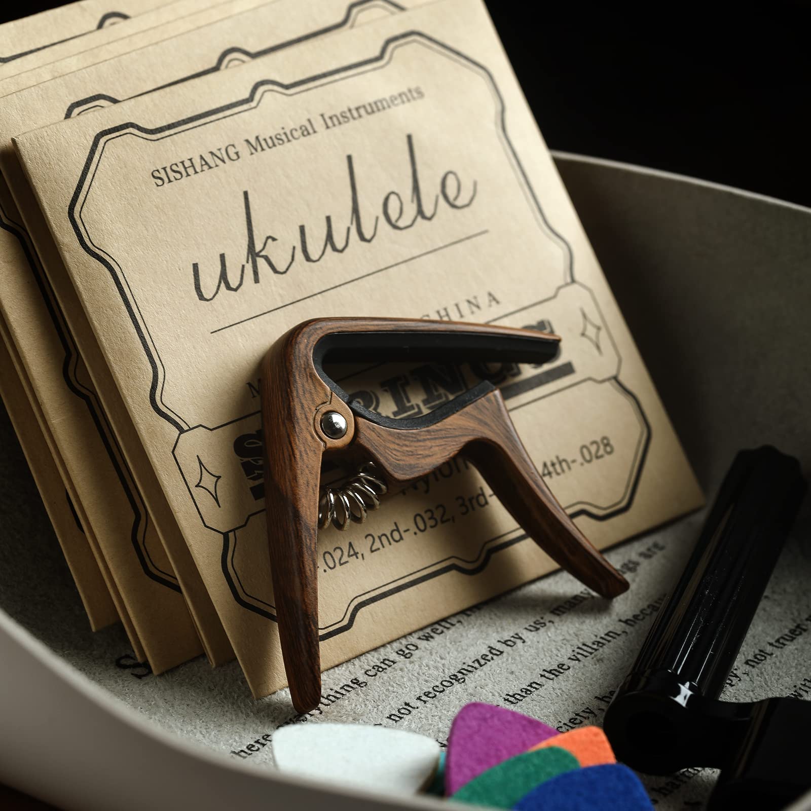 Donux Nylon Ukulele Strings Kit,Include 5 Sets Strings,10 Pieces Ukelele Felt Picks,Capo And String Winder For Soprano Concert A