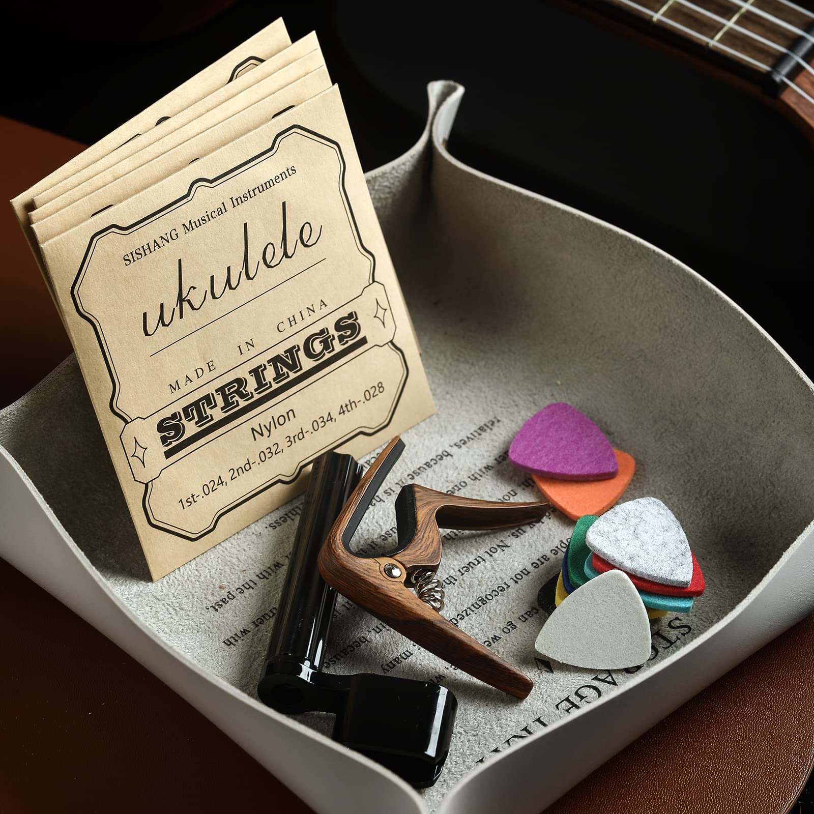 Donux Nylon Ukulele Strings Kit,Include 5 Sets Strings,10 Pieces Ukelele Felt Picks,Capo And String Winder For Soprano Concert A